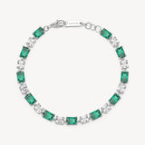 Bracciale in argento rodiato 925‰ con cushion cubic zirconia chiari e baguette cubic zirconia colore emerald. Lunghezza bracciale 18cm.