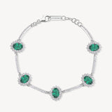 Bracciale Kate semirigido in argento rodiato 925‰ con oval cubic zirconia chiari e colore emerald. Lunghezza bracciale 18cm.