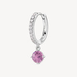 Orecchino singolo a cerchietto in argento rodiato 925‰ con cubic zirconia chiari e pendente con round cubic zirconia colore light ruby.