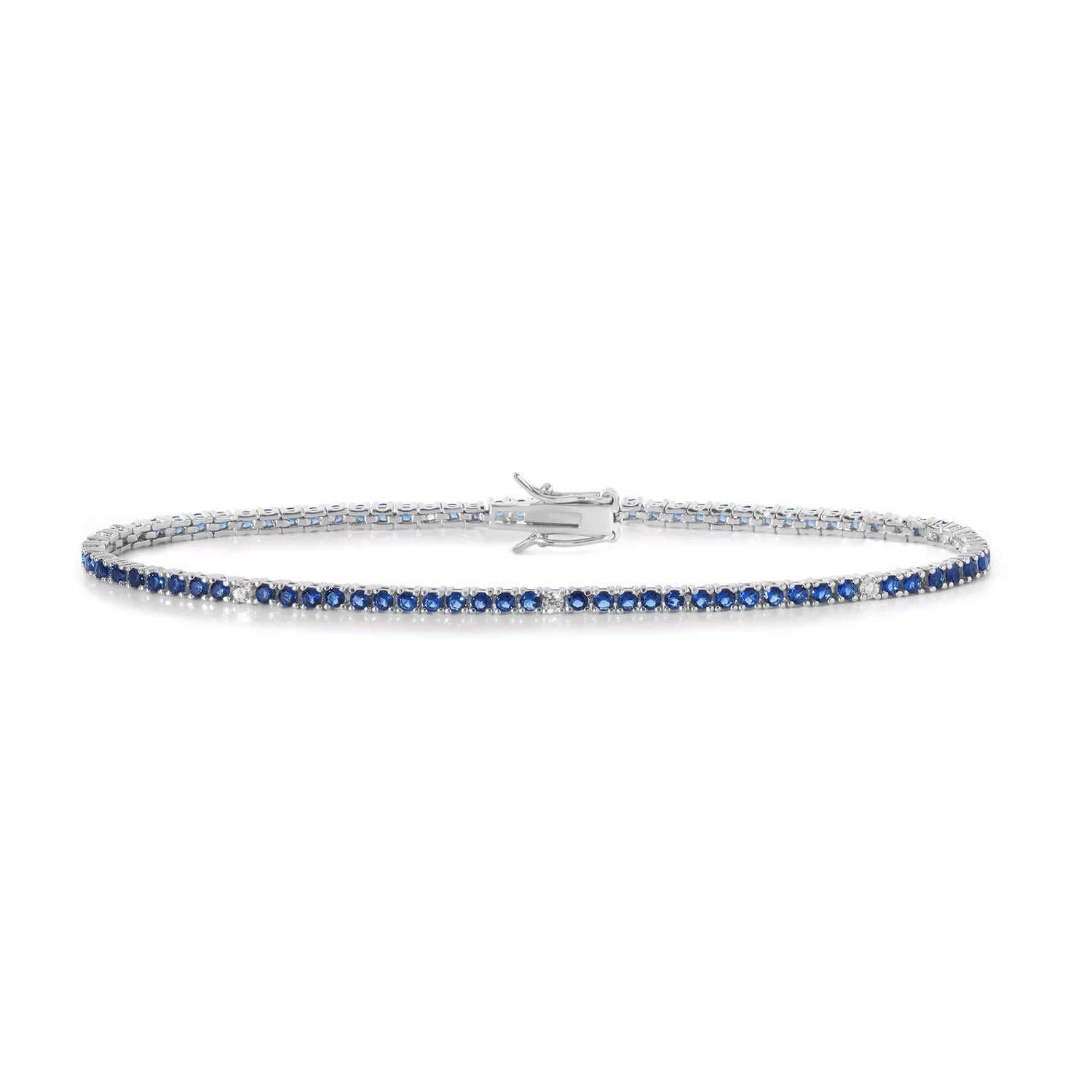 Comete bracciale in argento 925‰ modello tennis con zirconi color zaffiro blu e bianchi. Lunghezza bracciale 18 cm.