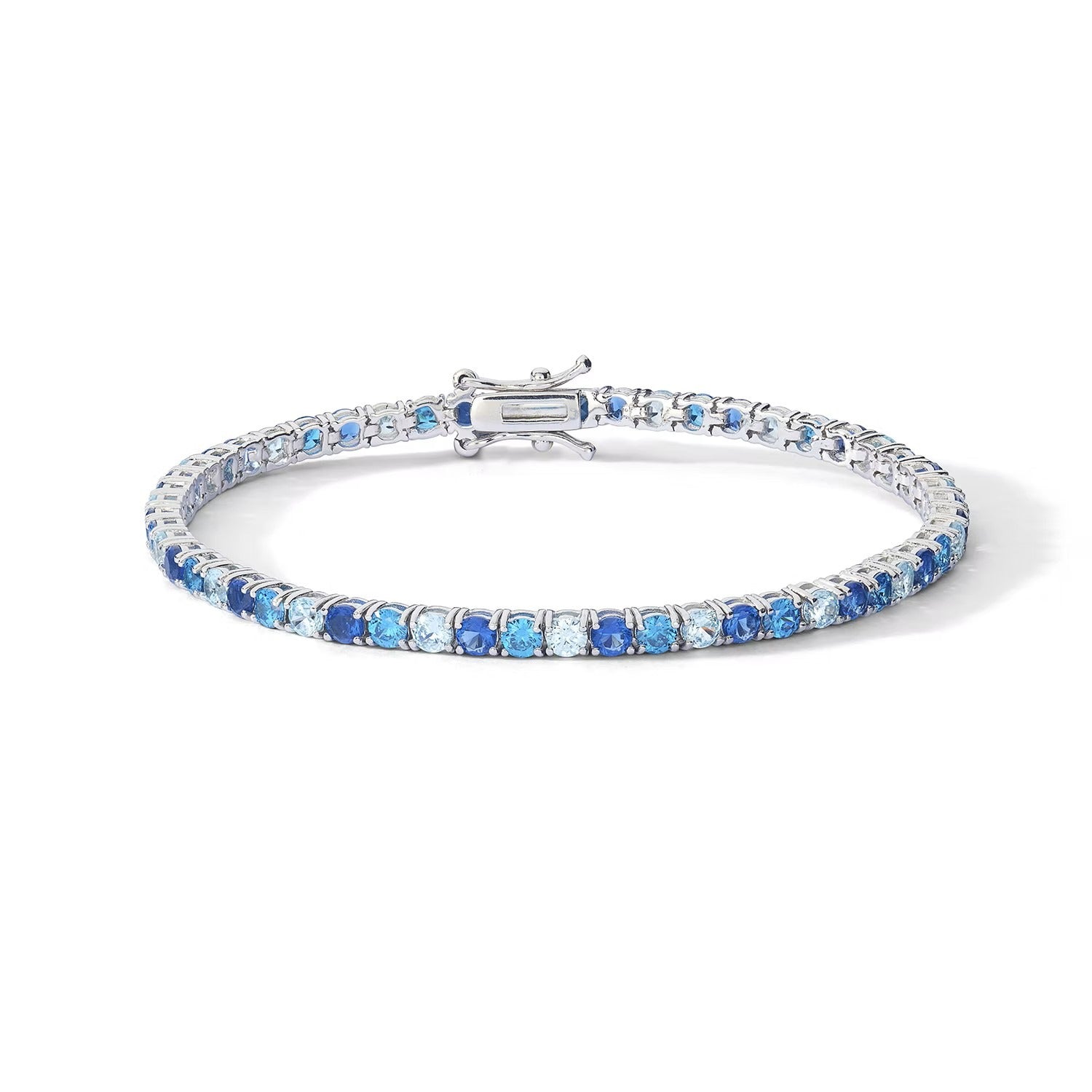 Comete bracciale in argento 925‰ modello tennis con zirconi color zaffiro, topazio e acquamarina. Lunghezza bracciale 18 cm.