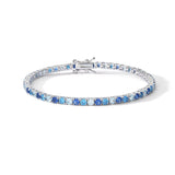 Comete bracciale in argento 925‰ modello tennis con zirconi color zaffiro, topazio e acquamarina. Lunghezza bracciale 18 cm.