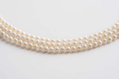 Collana lunga di perle con nappine