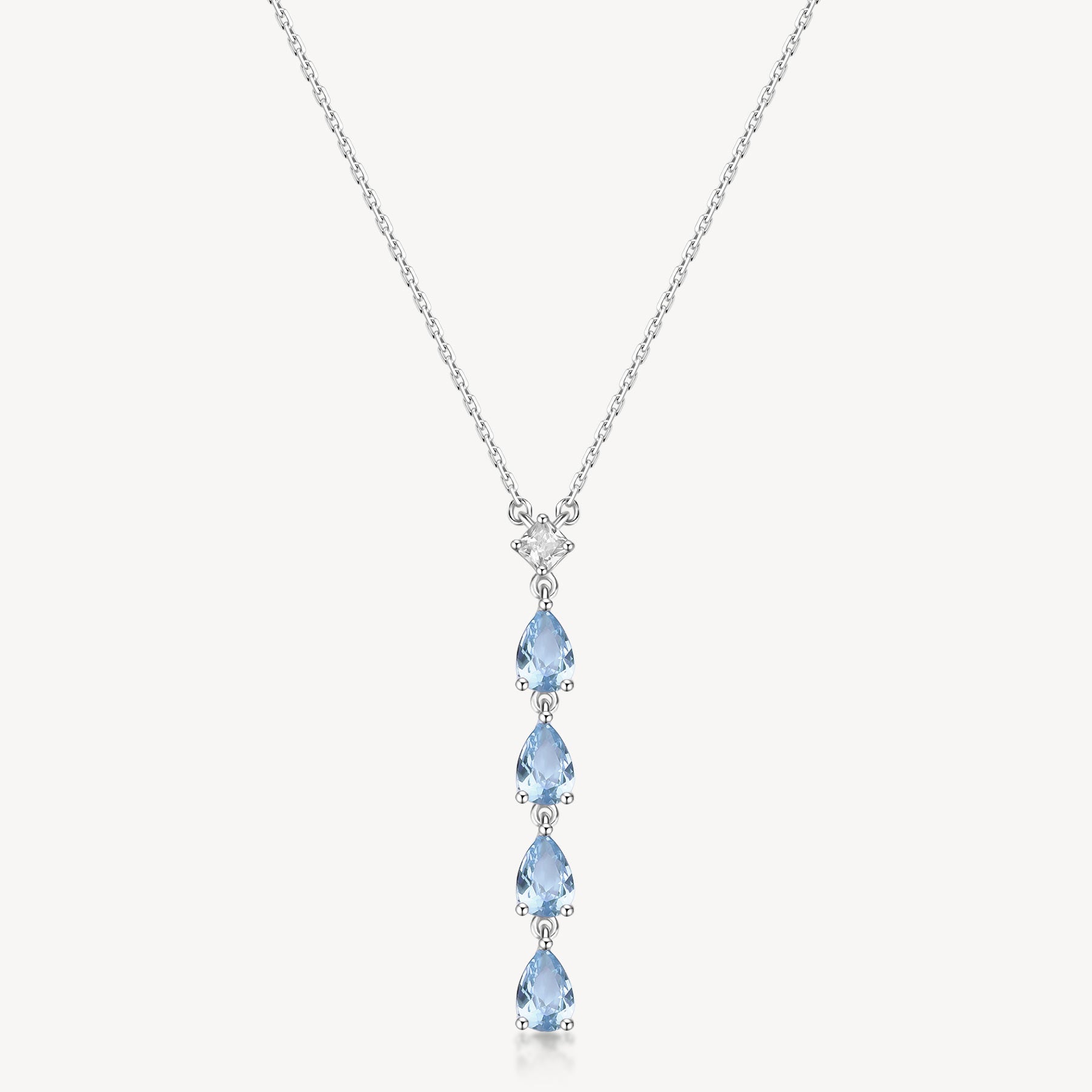 Collana girocollo in argento rodiato 925‰ e pendente con square cubic zirconia e pear cubic zirconia colore light sapphire.