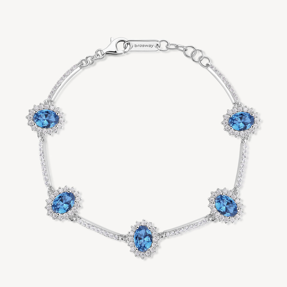 Bracciale Kate semirigido in argento rodiato 925‰ con oval cubic zirconia chiari e colore sapphire. Lunghezza 18cm.