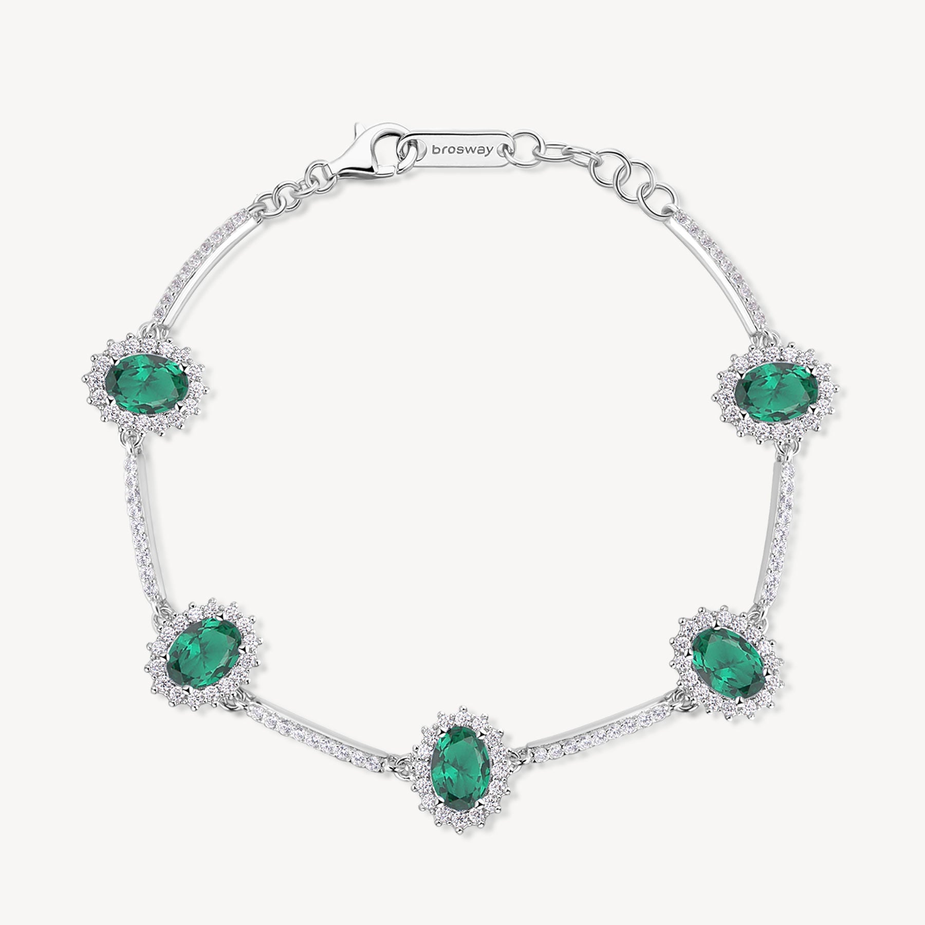 Bracciale Kate semirigido in argento rodiato 925‰ con oval cubic zirconia chiari e colore emerald. Lunghezza bracciale 18cm.