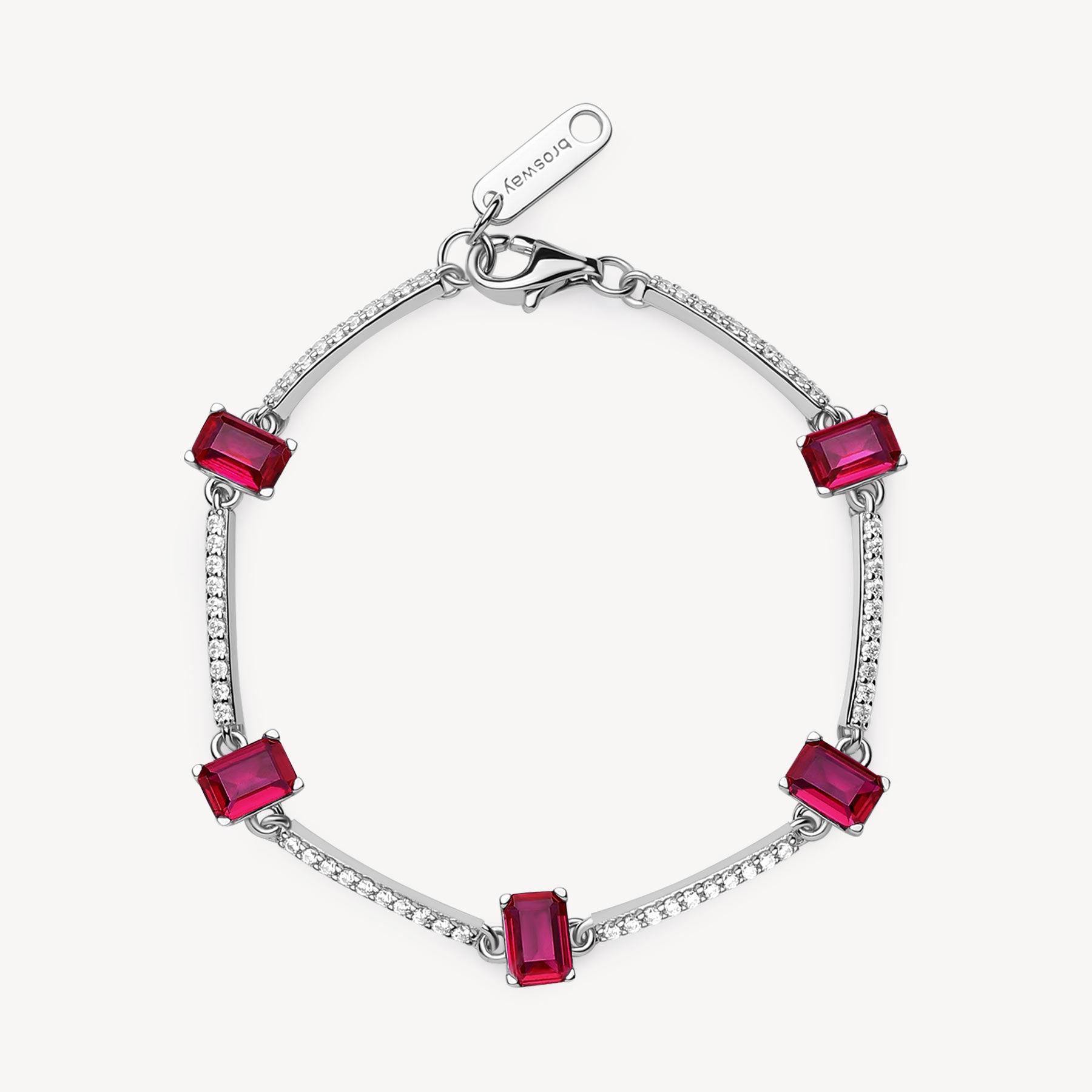 Bracciale semirigido in argento rodiato 925‰ con cubic zirconia chiari e baguette cubic zirconia colore ruby. Lunghezza bracciale 18cm.