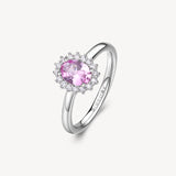 Anello kate in argento rodiato 925‰ con oval cubic zirconia chiari e colore light ruby. Misura anello 14.
